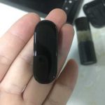 Xiaomi Mi Band 4 with a color display again lit up on the photo