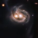 Look at the "smiley" from the merging galaxies
