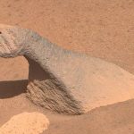 Look at a photo of a dinosaur-shaped Martian rock