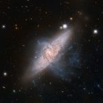 Look at pictures of two merging galaxies, taken 9 years apart