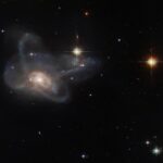 Look at the photo of the "many-armed" galaxy: this is an unusual merger of several objects