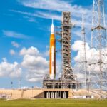 NASA reveals the first stage of the SLS rocket for the Artemis II mission, which will send people on a trip around the moon on the Orion spacecraft
